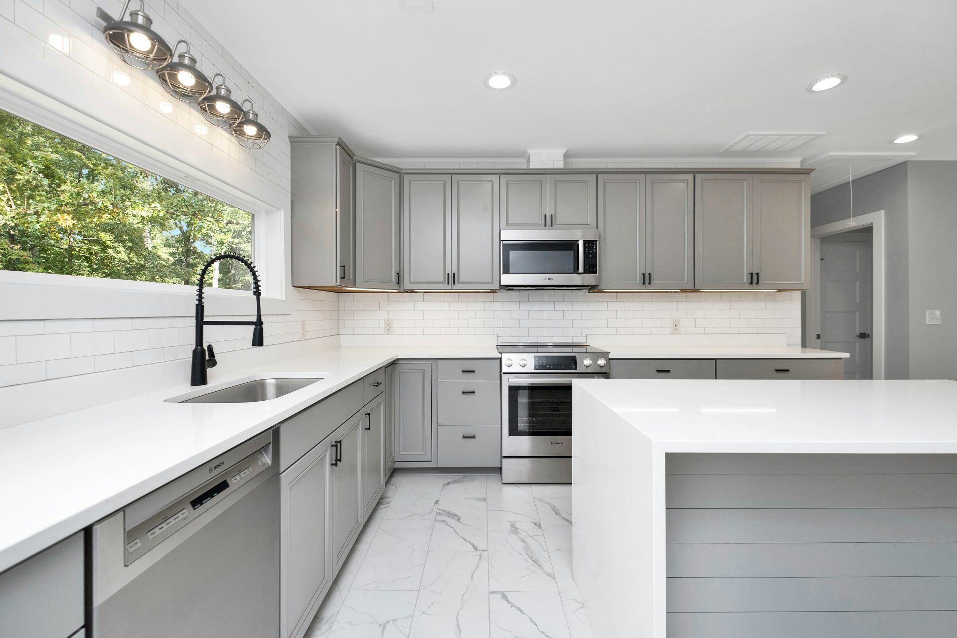 a kitchen with white cabinets